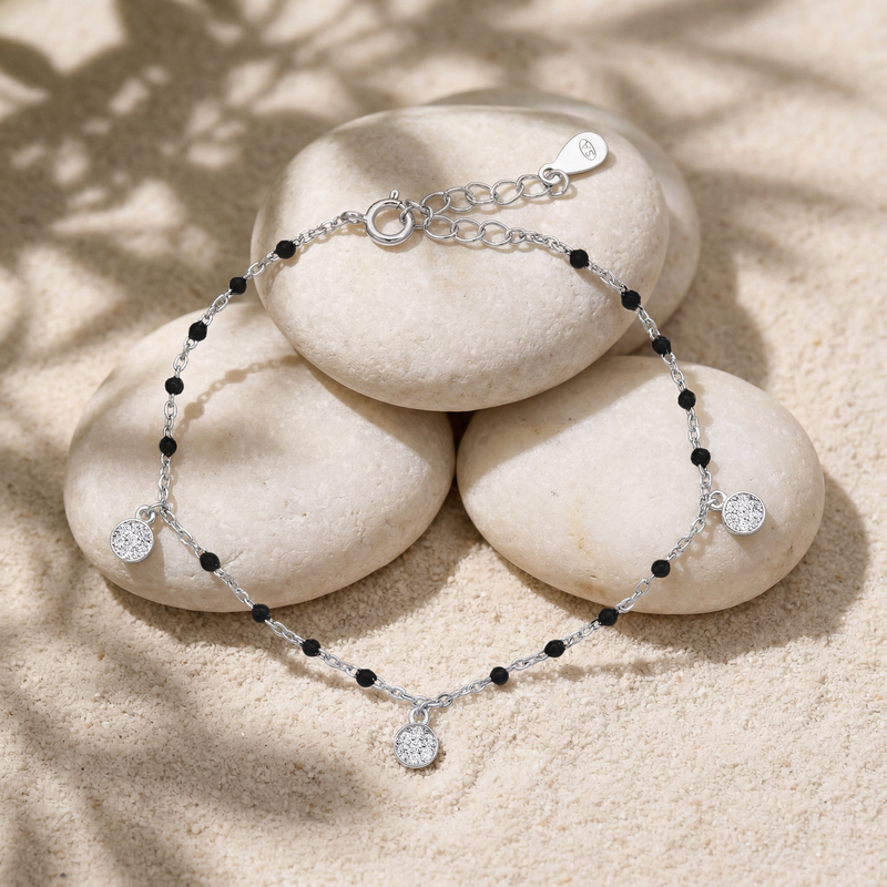 Sterling silver black-beaded charm bracelet