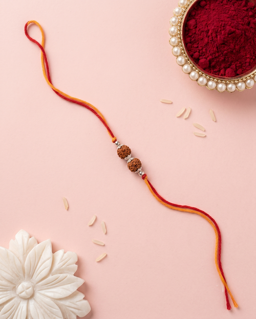 Load image 1 in gallery view. The Trinity Rudraksha Rakhi