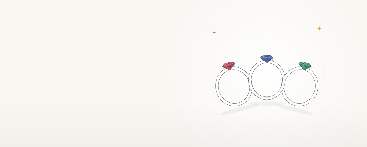 Three solitaire rings with ruby, sapphire and emerald stones, on ivory