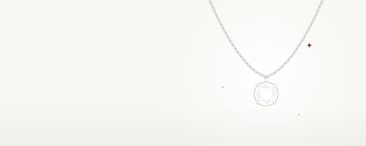 A solitaire pendant on a fine chain, on ivory